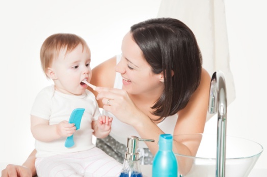 mom-brushing-baby-teeth